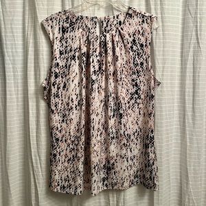 Pink black and white sleeveless blouse